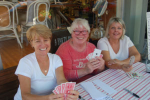 Photo courtesy of Downtown Camas Association 
 Poker dealers sit outside Camas Antiques during a past Camas First Friday Poker Tournament & Games Night.