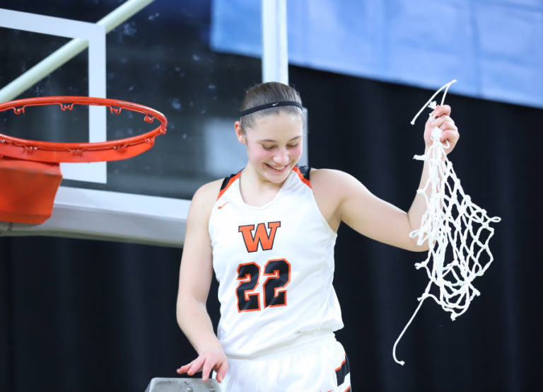 Contributed photo courtesy Britney Ervin 
 Washougal High School basketball player McKenna Jackson cuts down a net after the Panthers won the 2019 2A state championship in Yakima. (Doug Flanagan/Post-Record)
