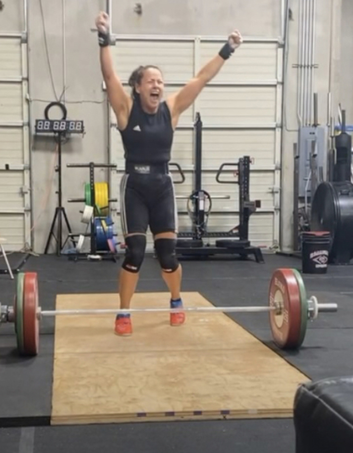 Katherine Brown celebrates after completing a lift during the 2021 International Weightlifting Federation World Masters Championships in June 2021. (Contributed photo courtesy Katherine Brown)