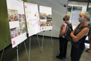 Doug Flanagan/Post-Record 
 Attendees look at sign boards during an informational presentation about the new Washougal library on Thursday, July 29. (Doug Flanagan/Post-Record)