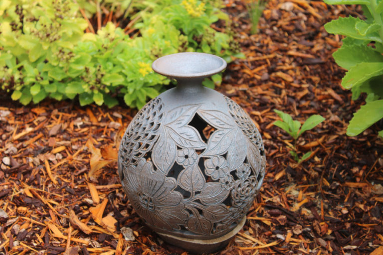 Kelly Moyer/Post-Record 
 Ken and Marge Crouch, of Camas, have incorporated a variety of gleaned free objects, such as this discarded vase, in their 1.7-acre natural garden.