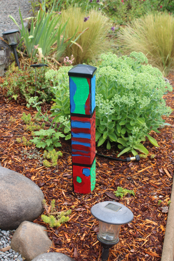A piece of art created by one of Ken and Marge Crouch&#039;s six young grandchildren adds color to the Camas couple&#039;s 1.7-acre garden on Friday, Aug.