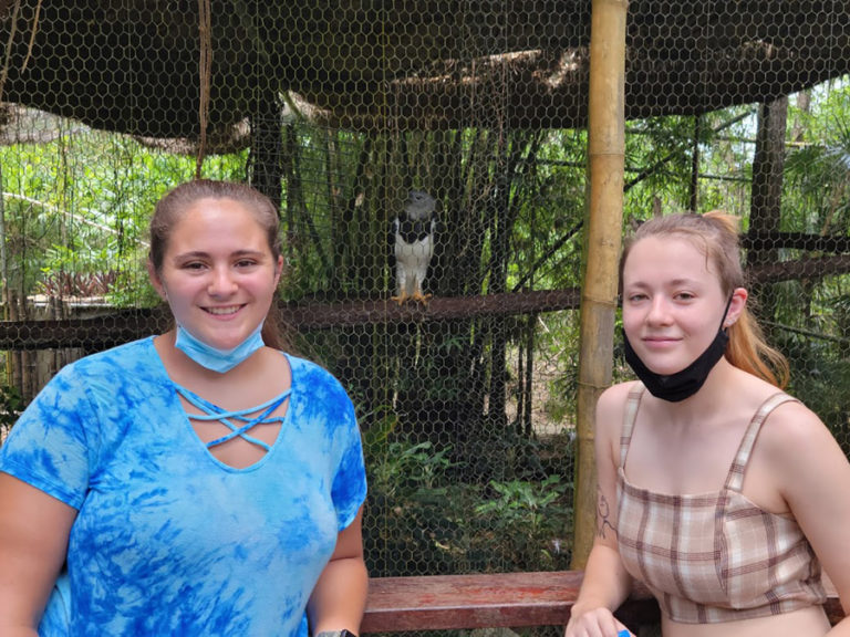 Washougal High School students Mariah Moran (left) and Jessica Troyer pose for a photograph at the Belize Zoo in July.