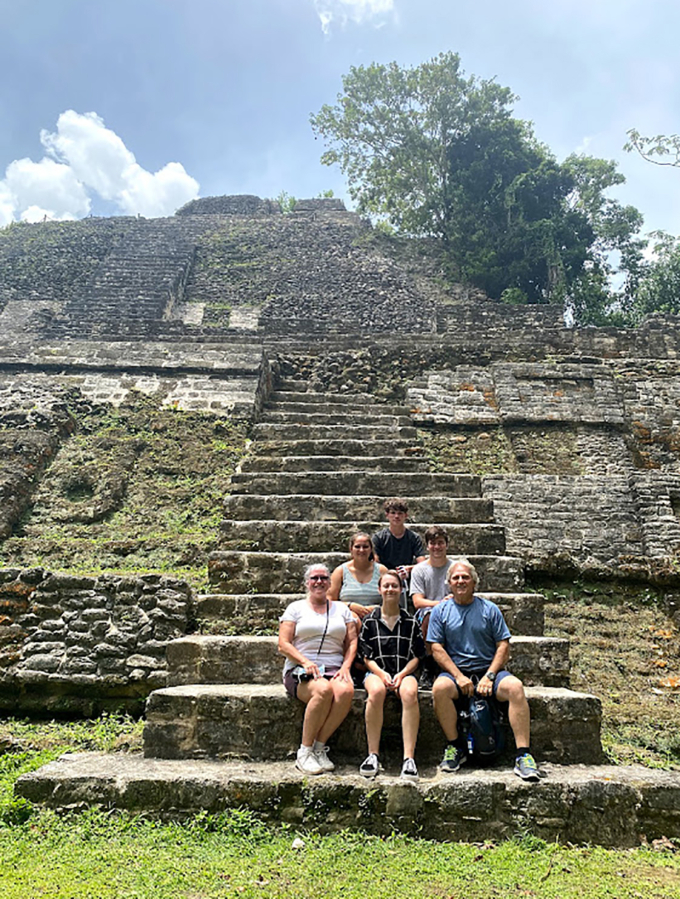 From top to bottom, left to right, Josiah Aiton, Mariah Moran, Blake Scott, Rochelle Aiton-Quested, Jessica Troyer and Craig Grable sit in front of the ruins of Lamani, an ancient Mayan city, during an educational tour of Belize in July.