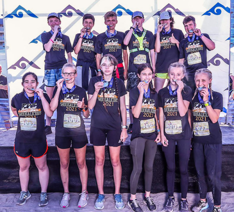 Contributed photo courtesy Tracey Stinchfield 
 Members of the &quot;Shougalicious&quot; running team celebrate with their medals after winning the 2021 Portland to Coast Challenge Relay Run on Aug. 29.