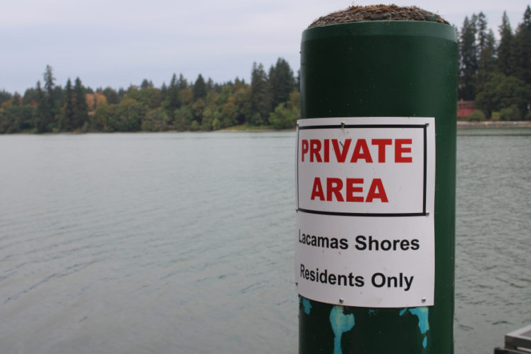A sign warns that a private boat on Lacamas Lake is for residents of Lacamas Shores only on Friday, Sept.