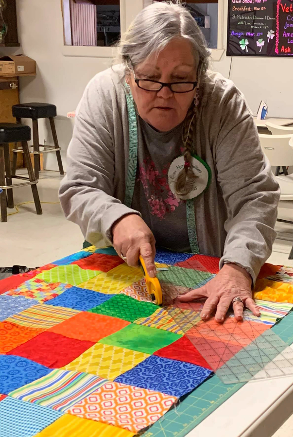 Phyllis Thornton, of Washougal, works on a quilt during a 2021 meeting of the Cape Horn Quilters.