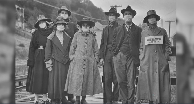 A video in the Washougal School District&#039;s &quot;Mystery Science&quot; curriculum includes an image of people posing for a photograph during the Spanish flu pandemic of 1918.