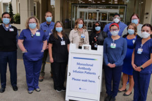 The PeaceHealth monoclonal antibody therapy team stands outside the Vancouver hospital. Pictured from left to right are: Victor Garcia, Roselita Bird, Christe McDaniel, Denise Gideon, Rachael Vogel, Jennifer Halsey, Jim Shimer, Colleen Schaeffer, Haley Ellis, Elisa Jaime and Porsha Winder. (Contributed photo courtesy of PeaceHealth)