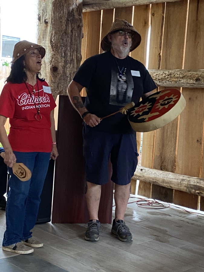 Mildred Robinson (left) and Sam Robinson, of the Chinook Indian Nation, sing a blessing during a dedication ceremony for the Gathering Place at Washuxwal pavilion at the Two River Heritage Museum in Washougal on Sept. 18, 2021.