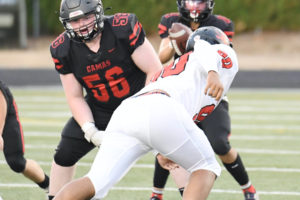 Camas offensive lineman Noah Christensen (56) snaps a football during the Papermakers' game against Clackamas High School on Sept. 10, 2021. (Contributed photo courtesy of Kris Cavin)