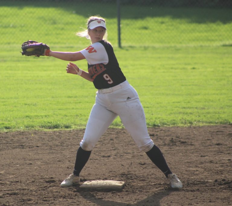 Washougal High senior Natalie Collins catches a ball to tag out a runner at second base during the first game of a doubleheader against Columbia River High School on Oct.