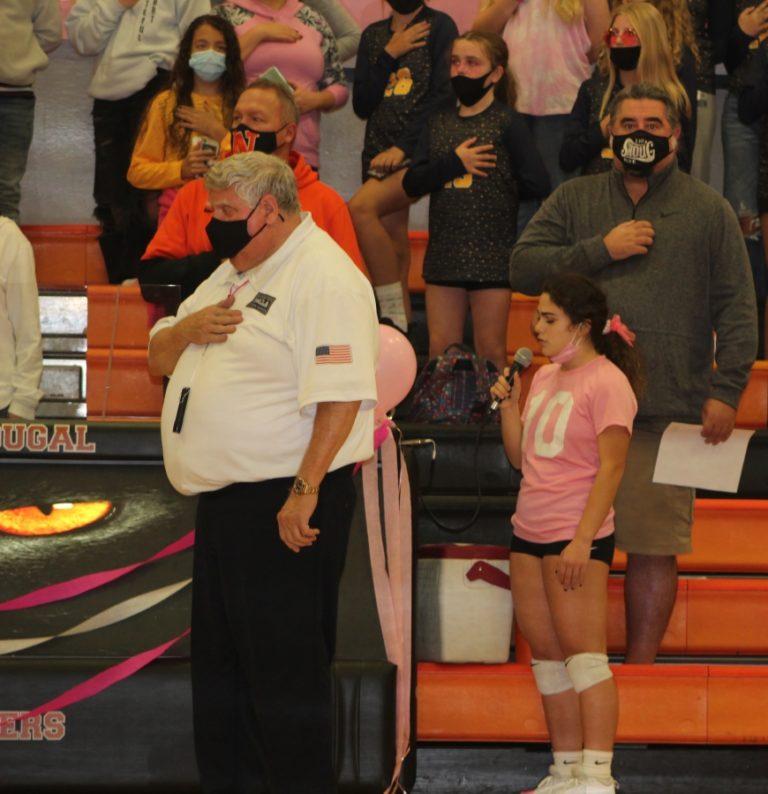 Doug Flanagan/Post-Record 
 Washougal High School senior volleyball player Lexi Melton sings &quot;The Star Spangled Banner&quot; before the start of the Panthers&#039; Oct. 14 game against Hudson's Bay at Washougal High School.