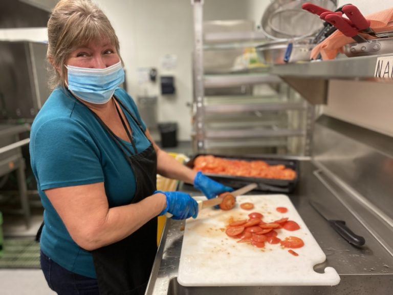 Washougal School District employee Glenda Huddleston prepares food for students and employees in 2020.
