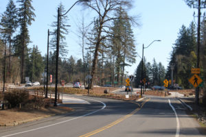 Drivers flow through a newly constructed traffic roundabout at Northeast Everett Street and Lake Road in Camas on March 9, 2021. (Kelly Moyer/Post-Record files)