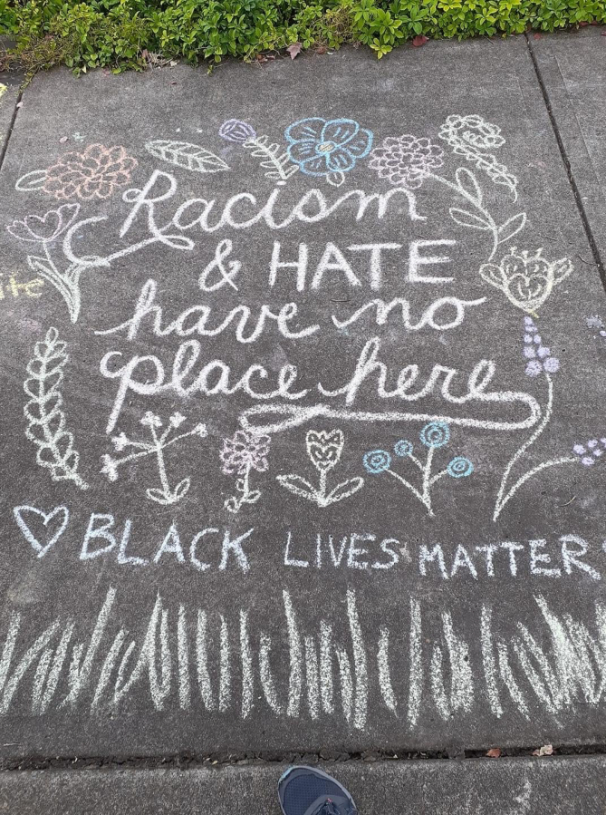 Chalk art in support of the Black Lives Matter social justice movement stands outside the Camas Public Library in July 2020.