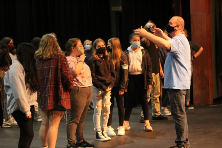 Washougal High School drama teacher Kelly Gregersen (right) talks to students during a rehearsal for the Washougal School District&#039;s upcoming musical production of &quot;All Together Now!&quot; at Washougal High School on Nov. 5, 2021.