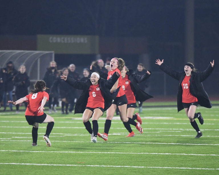 The Camas girls soccer team celebrates a 1-0 victory over Issaquah during the 4A state championship tournament at Sparks Stadium in Puyallup, Wash., on Nov. 20, 2021.