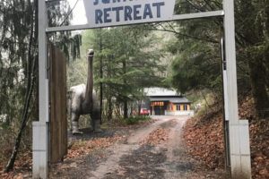 A sign and an animatronic
apatosaurus welcome guests to the "Jurassic Retreat" home in rural Washougal.