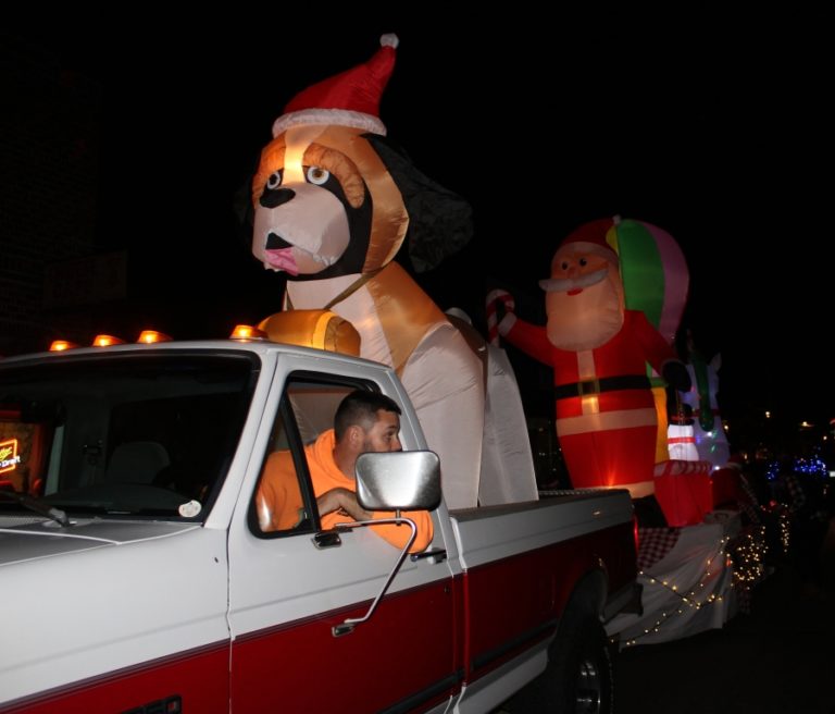 A lighted vehicle decorated with a Santa Claus and his helpers drives down Washougal’s Main Street during the Washougal Lighted Christmas Parade on Dec 2, 2021. (Doug Flanagan/Post-Record)