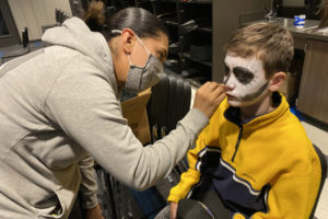 Washougal resident Ambar Tellez-Jurado  (left) paints Jemtegaard Middle School student Cole Wilson's face during the school's Dia de los Muertos event on Nov. 2, 2021. (Contributed photos courtesy of the Washougal School District)