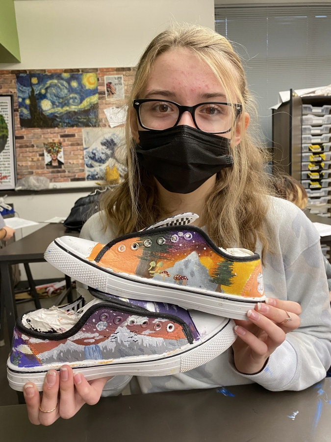 Jemtegaard Middle School student Elanor Livengood shoes reflect that she&#039;s inspired by the beauty of mountains and her dog Josie, and that she dreams to work professionally with dogs and visit Arizona to see cactus and Alaska.
