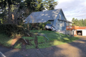 A car with juvenile passengers on their way to school Tuesday, Dec. 14, crashed into a house in Camas. One boy died in the crash. (Contributed photo courtesy Clark County Sheriff's Office)