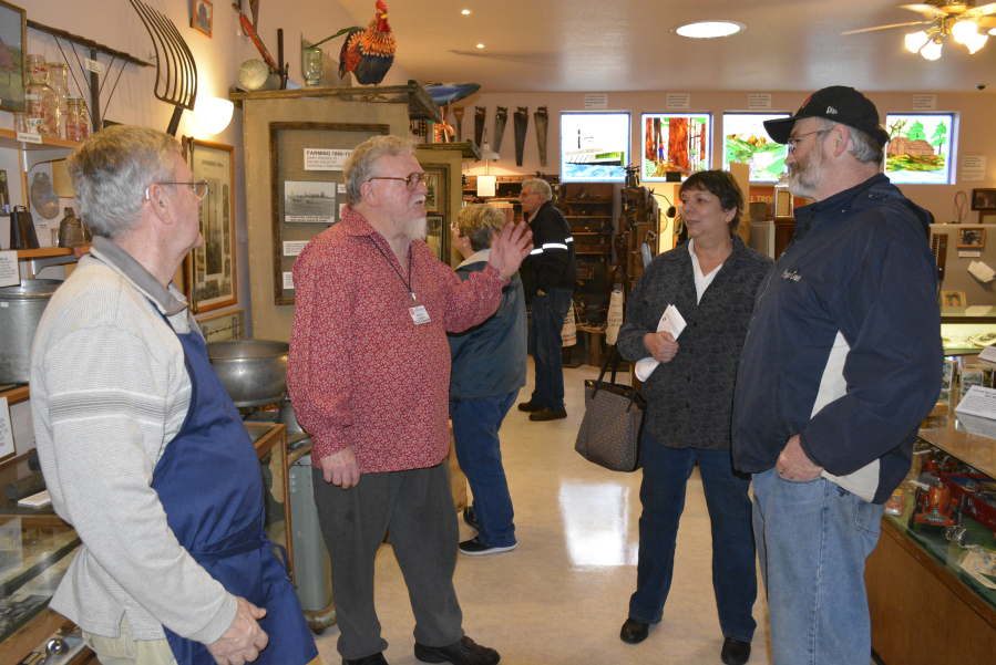 Two Rivers Heritage Museum guests visit with docents Richard Johnson and Richard Lindstrom during an open house in 2016.