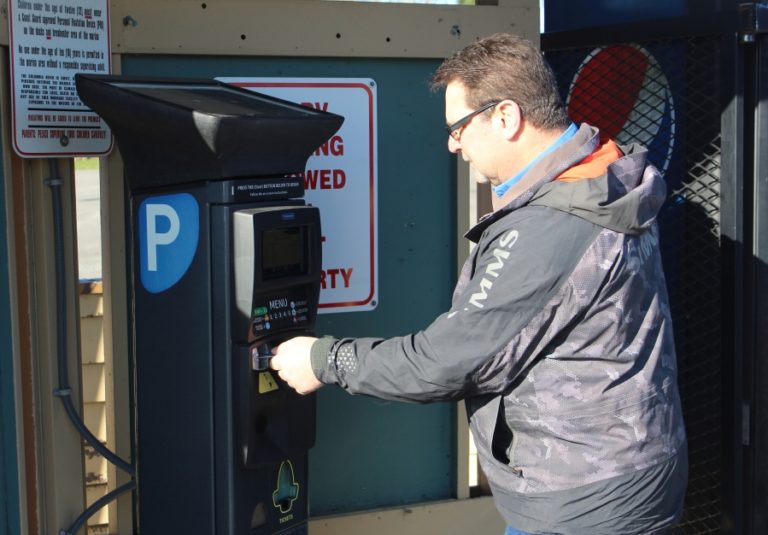 Doug Flanagan/Post-Record 
 Washougal resident Mike Amodeo inserts a credit card into a ticket machine at Parker&#039;s Landing Marina on Tuesday, Jan. 25.