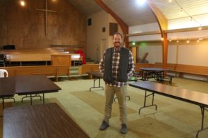 Camas Church of the Nazarene Pastor James Austin stands in the main room of The Outpost. (Doug Flanagan/Post-Record)