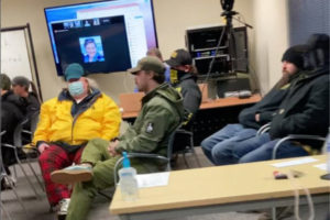 Several people who refused to follow public health rules regarding face coverings sit inside the Washougal School District's meeting room before a Washougal School Board meeting on Tuesday, Jan. 25, 2022. (Contributed photo courtesy of Wendi Moose)