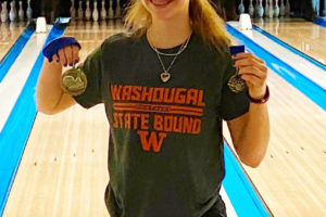 Washougal High freshman Addysen Case, a member of the Skyview High School bowling team, holds her medals after winning the 4A District 1 team championship on Jan. 28, 2022. (Contributed photo courtesy of Washougal High School)