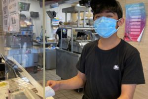 Canyon Creek Middle School student Rylan Stalnaker shows his 3D design prototype is being piloted to help the Washougal School District's facilities and custodial departments with the hand sanitizer spillage. (Contributed photo courtesy of the Washougal School District)