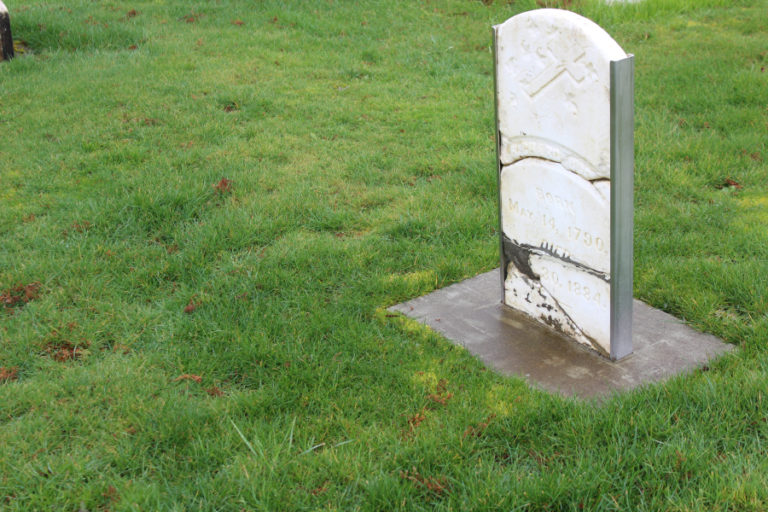 The gravestone of early Washougal settler Richard Ough is displayed in the pioneer section of the Washougal Memorial Cemetery.