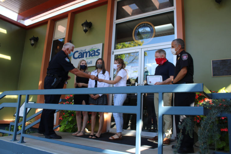 Camas Police Chief Mitch Lackey (left) thanks Vancouver teens (from left to right) Hannah Salinas, Hillary Darland and Maddy Gregory for rescuing a 5-year-old girl and her father at the Camas Potholes in July 2020. Lackey, along with Camas Mayor Barry McDonnell (second from right) and Camas-Washougal Fire Chief Nick Swinhart honored the girls on Friday, Aug. 7, 2020, with a brief ceremony in front of Camas City Hall.