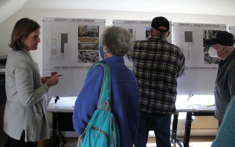 Doug Flanagan/Post-Record 
 Laura Klinger of Hacker Architects (left) talks with attendees during a public meeting about the new Washougal library on Wednesday, March 16, at the Children&#039;s Home Society of Washington building in Washougal.