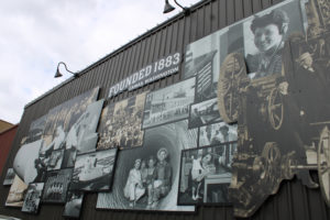 A mural showcasing events from Camas' history hangs on a building near the intersection of Northeast Fourth Avenue and Northeast Adams Street in downtown Camas on Monday, March 28, 2022. The Downtown Camas Association's "Spring into History" themed First Friday event, set to kick off at 5 p.m. Friday, April 1, 2022, will feature a walking history tour, a historical display inside the paper mill's interpretive lobby and other history related activities. (Kelly Moyer/Post-Record)