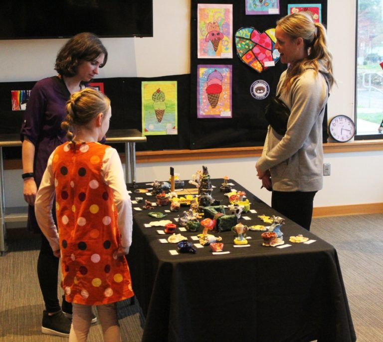 Doug Flanagan/Post-Record 
 Attendees look at student artwork during the 2022 Washougal Youth Arts Month gallery exhibit on Wednesday, March 23, at Washougal High School.