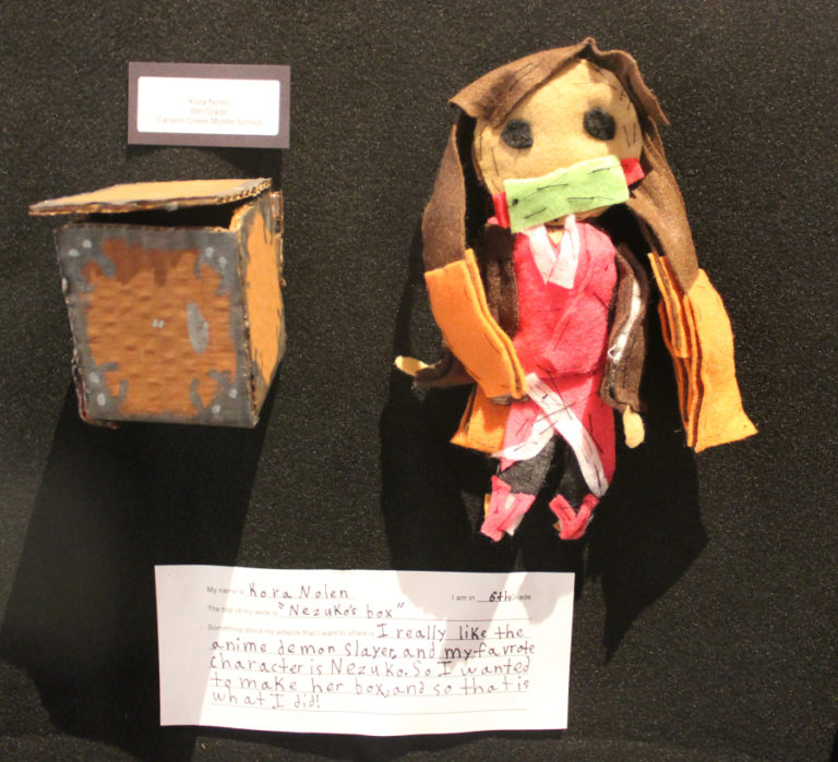 A recreation of the band KISS, created out of cardboard and other materials by Canyon Creek Middle School sixth-grader Kaleb McCuen, is displayed during the 2022 Washougal Youth Arts Month gallery exhibit at Washougal High School on Wednesday, March 23, 2022.