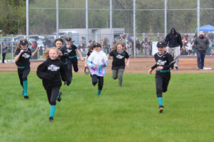 An East County Little League softball team's players and coaches run to the fence of the new field at the George Schmid Memorial Ballfields in Washougal on Friday, April 22, 2022. (Photos by Doug Flanagan/Post-Record)