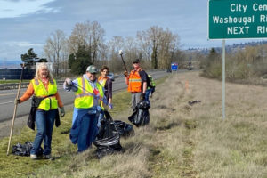 Contributed photo courtesy Melanie Wilson 
 Camas and Washougal residents (from left to right) Brenda Hatton, Lynne Lyne, Wendi Moose, and John Meier pose for a photograph while picking up trash alongside State Route 14 on Saturday, March 23. (Contributed photo courtesy of Melanie Wilson)