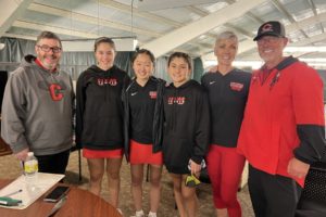 From left to right: Camas girls tennis head coach Jonathan Burton, doubles partners Taryn Kerker and Jace Moriki, singles player Hailey Kerker and assistant coaches Annie Sumpter and Craig Sumpter gather during the 2022 4A girls tennis state championships, held in Kennewick, Wash. Hailey Kerker took took first place in singles and Taryn Kerker and Moriki placed fourth in doubles, leading the Papermakers to a first-place finish in the team standings. (Contributed photo courtesy of Annie Sumpter)