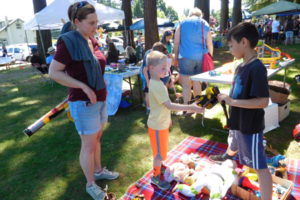 Visitors to the 2018 Camtown Youth Festival peruse toys and homemade crafts at the children's flea market. (Post-Record files)