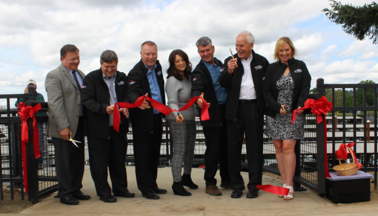 Doug Flanagan/Post-Record 
 From left to right, Camas Mayor Steve Hogan, Port of Camas-Washougal commissioner Larry Keister, Port of Camas-Washougal director of business development and real estate Derek Jaeger, Washougal Mayor Rochelle Ramos, Port of Camas-Washougal commissioner John Spencer, American Quen Voyages chairman John Waggoner and American Queen Voygages director of port services Shelly Hartfield cut a ribbon at Washougal Watrefront Park on Wednesday, June 8.