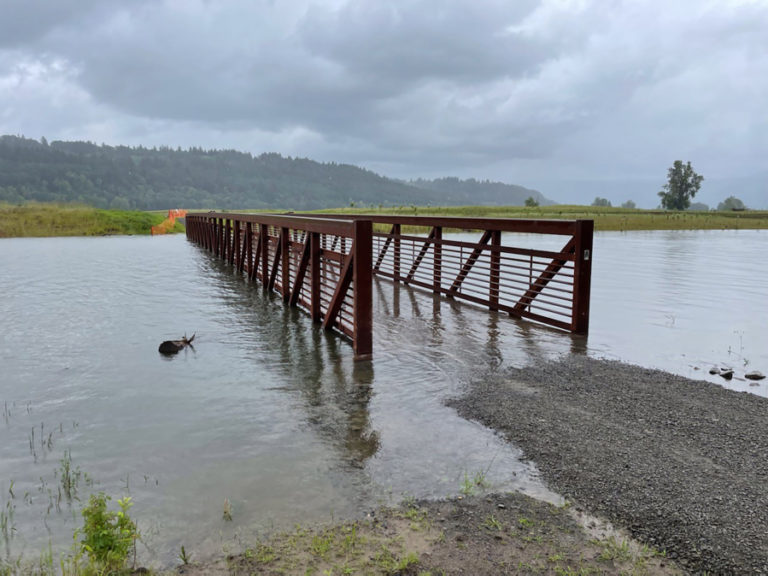 A trail at Steigerwald Lake National Wildlife Refuge is under water after heavy rainfall, melting snowpack and an unusually wet spring contributed to flooding in the region in June 2022.