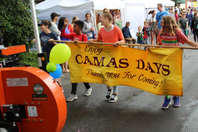 Youth carry a sign in the 2019 Camas Days main parade in July 2019, in downtown Camas.