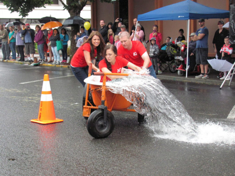 Ice-cold water spills from a bathtub in the 2017 Camas Days' bathtub races.