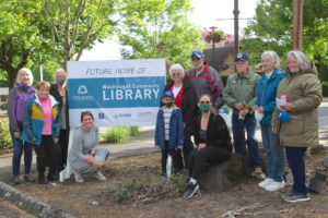 Contributed photo courtesy Rene Carroll 
 Friends of the Washougal Library fundraising group members pose for a photograph in front of a sign at hte future home of the new Washougal library in 2021.