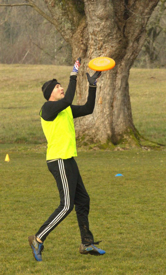 Brandon Zarzana, a member of the Goot Times Ultimate team, catches a flying disc at Goot Park in Camas in 2022.