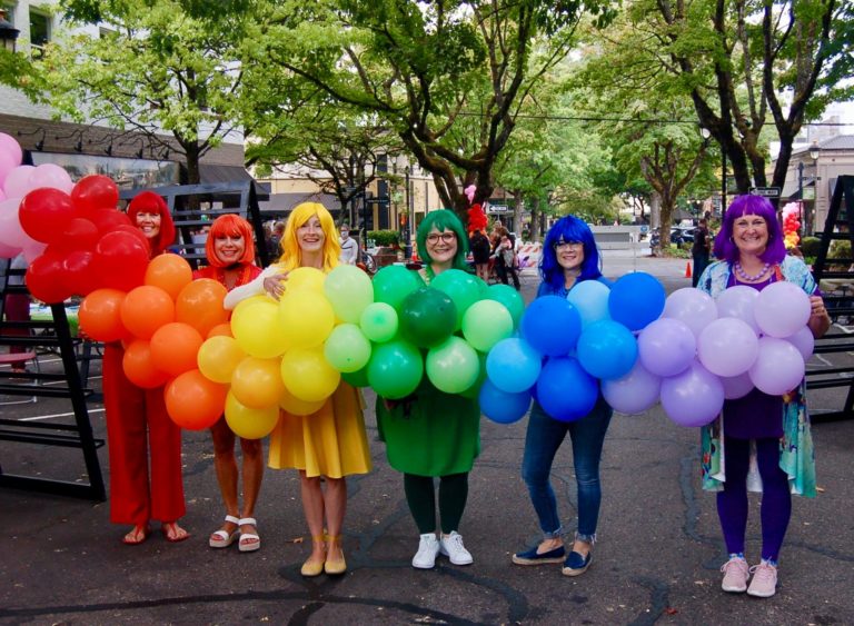 Visitors to the 2021 Picnic in Color show off their bright, colorful outfits. This year's Picnic in Color is set for Sunday, July 24, 2022, in downtown Camas.